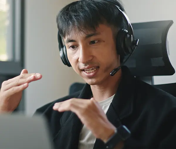 Man explaining a topic while talking on a webcast