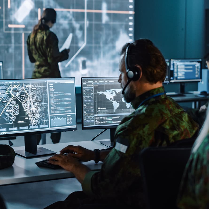 Soldiers in Uniform Using Computers and Tracking Threats