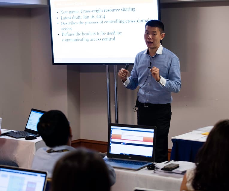 Jason Lam: Teacher Talking in Front of a Classroom