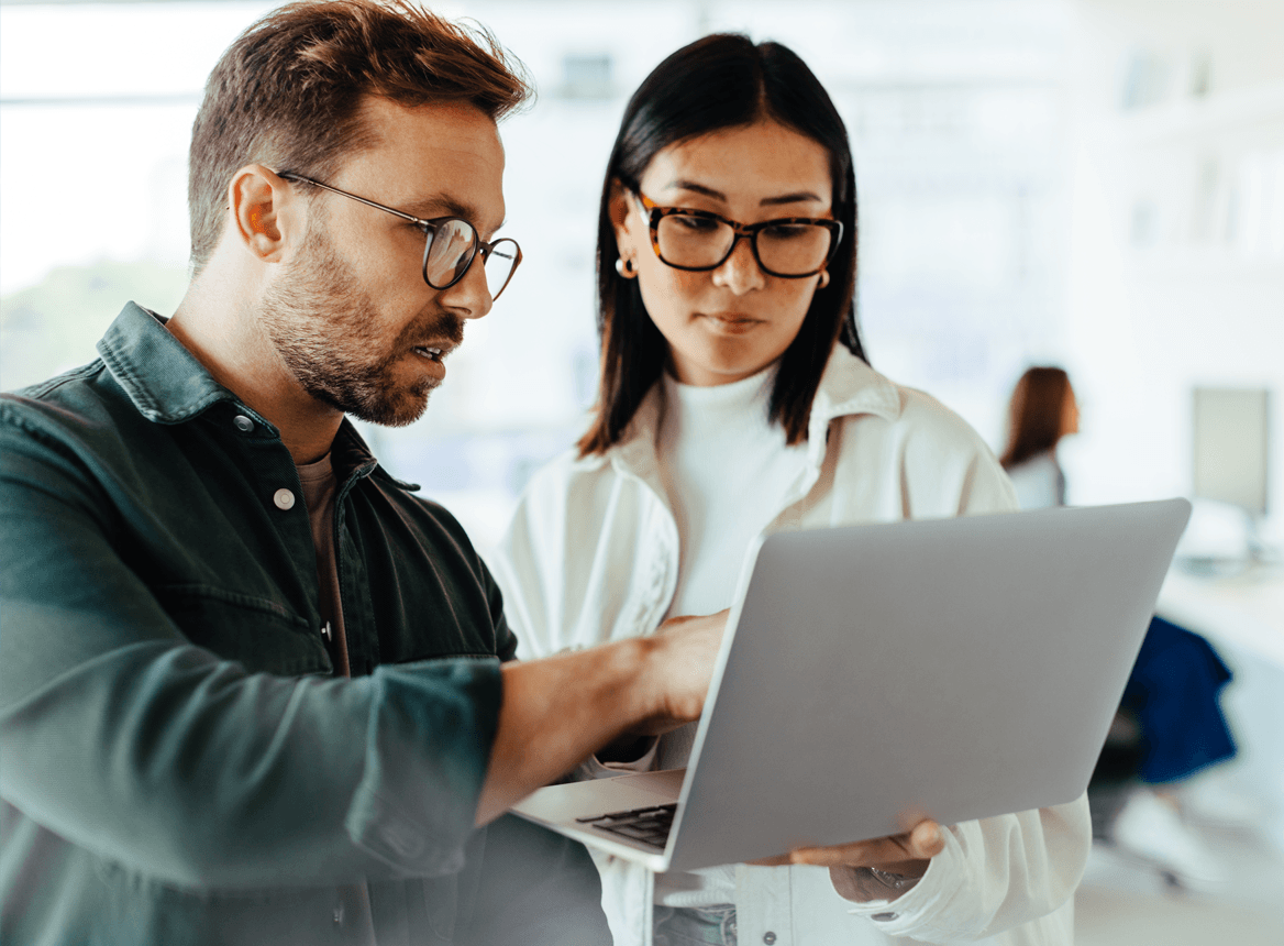 2 People Looking at Laptop
