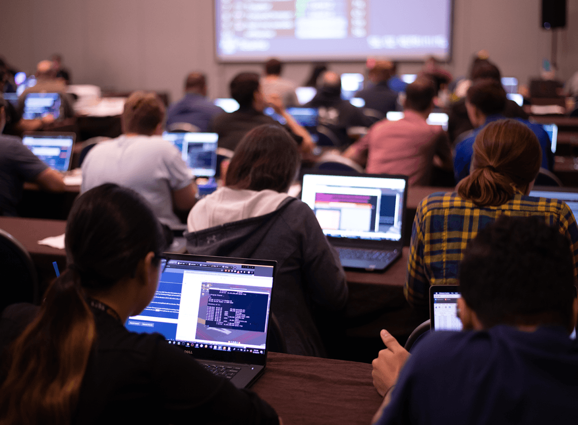 People In A Classroom Working on Laptops