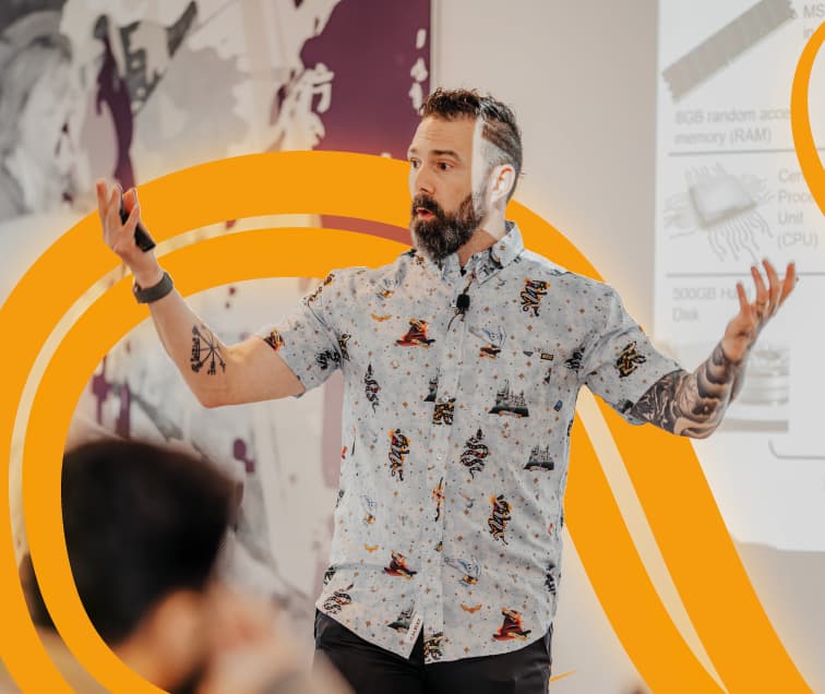 Rich Greene: Arms Up as an Instructor Talks to Class