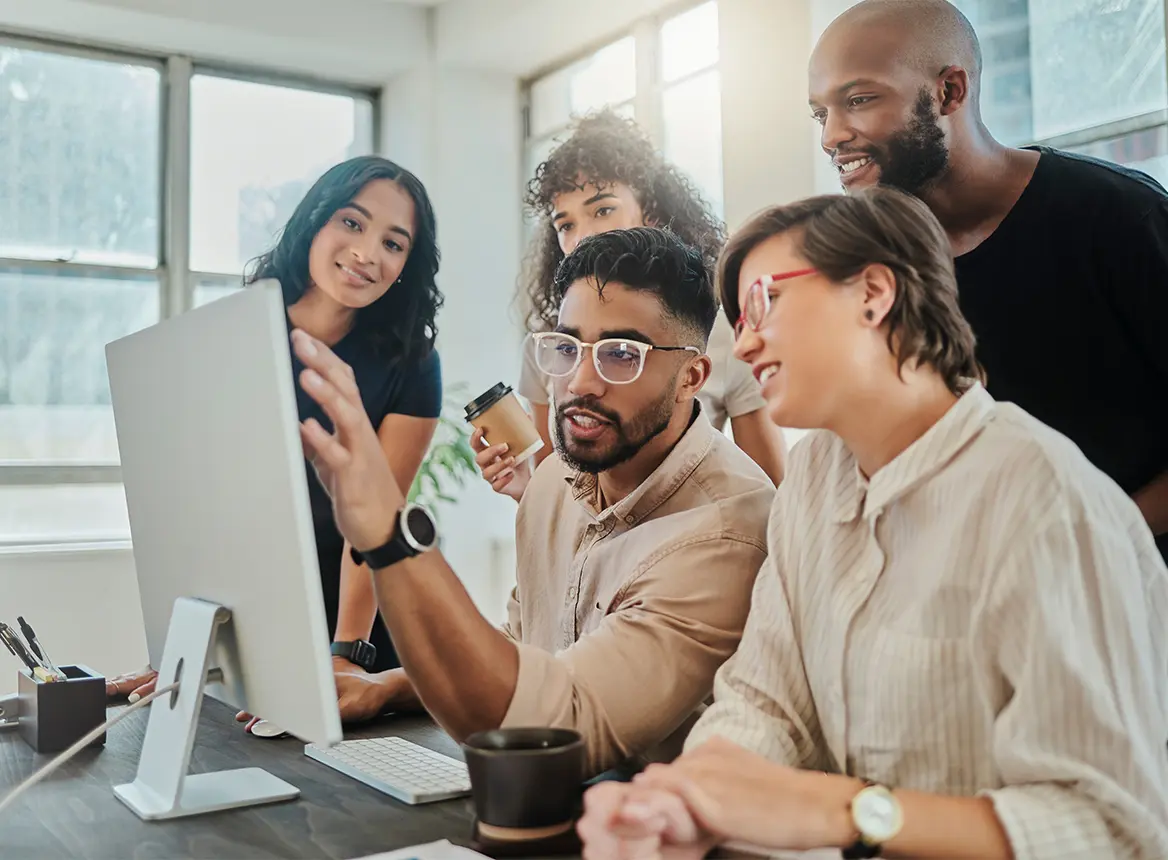 Two People Looking at a Computer